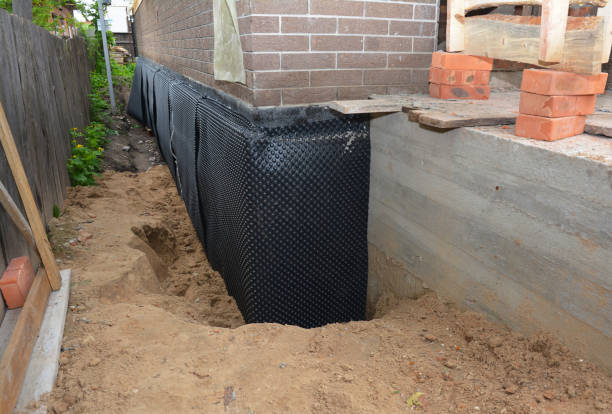 SJ Waterproofing Pros technician performing targeted Waterproofing assessment in Burlington, MI